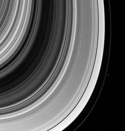 At the edge of Saturn: artificial intelligence in search of new moons